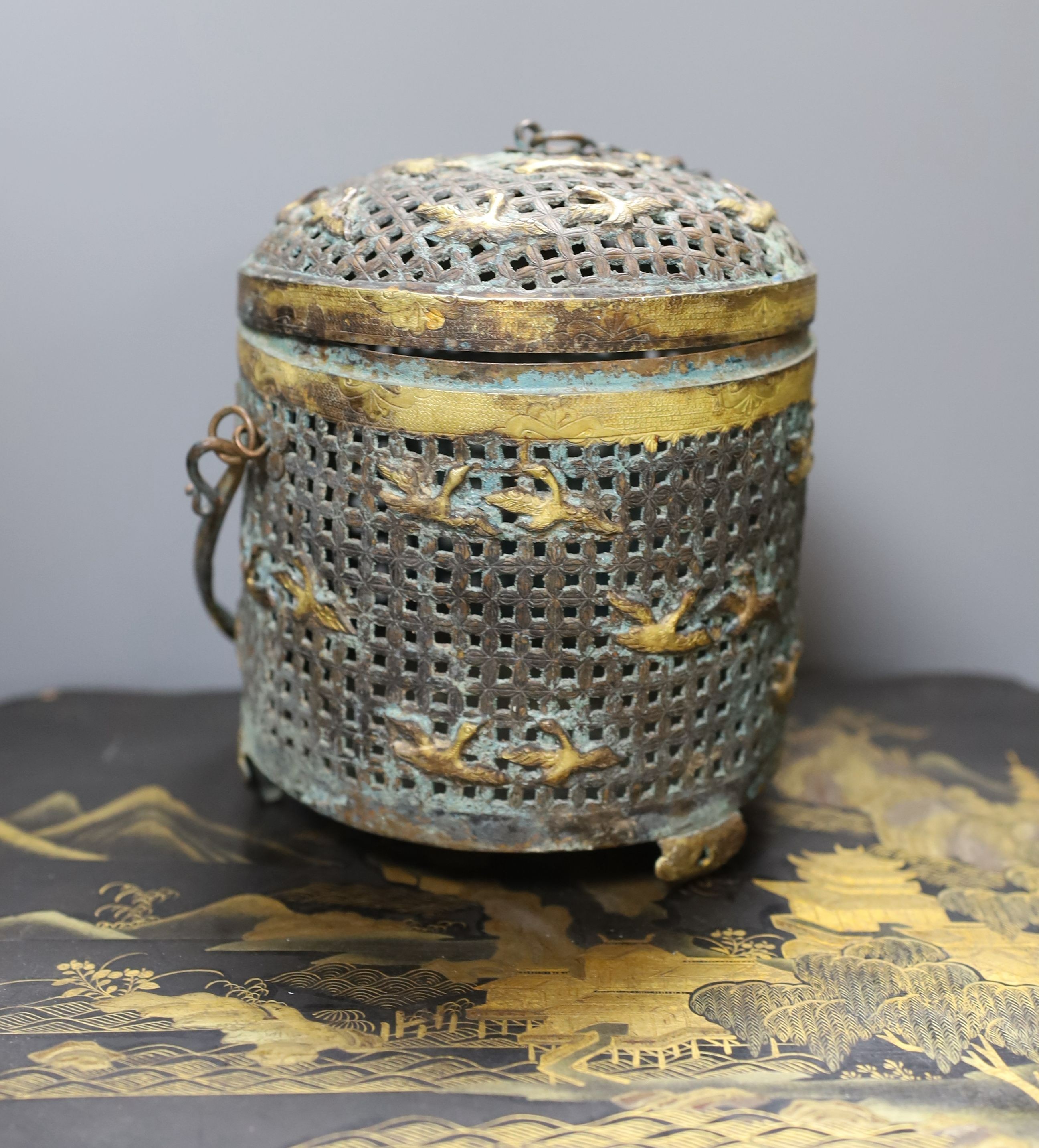 A Chinese gilt metal pierced jar and cover decorated with birds, together with a large Chinese lacquer box (2)